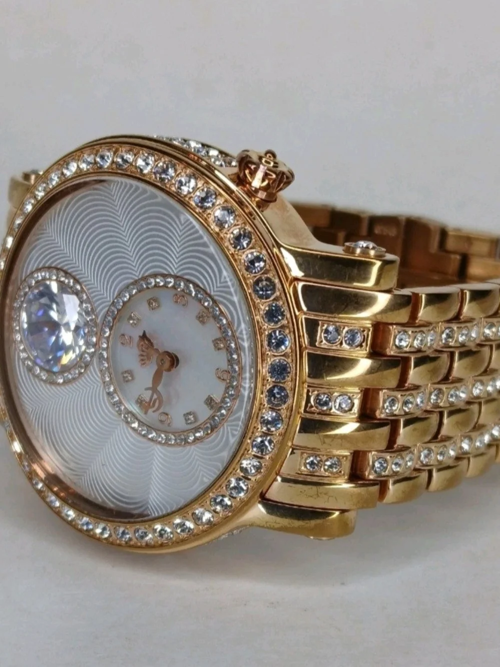 ​Juicy Couture Gold Tone Crystal Bezel Floating Solitaire Watch